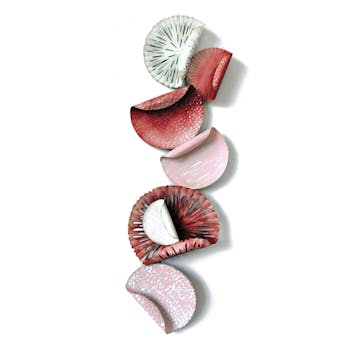 Décoration murale Disques enroulés rouges et rose en métal 29x88cm