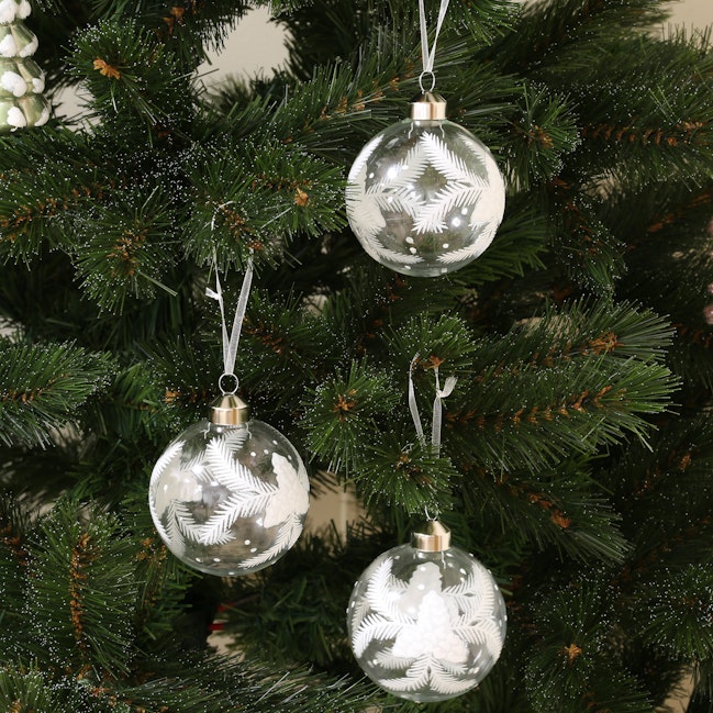 Boite de 3 boules blanches décor feuilles de Noël