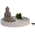 Jardin zen avec Bouddha, sable et plante