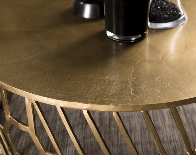 Table basse ronde en metal dore de style contemporain