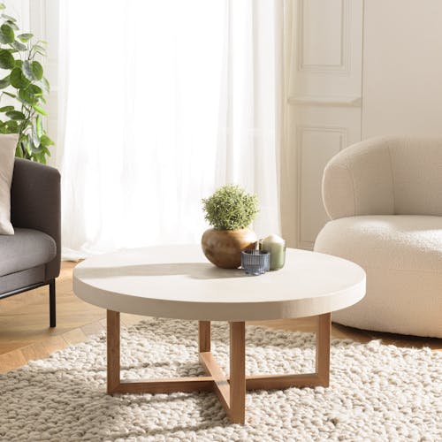 Table basse ronde béton beige pieds bois croisés DIKA