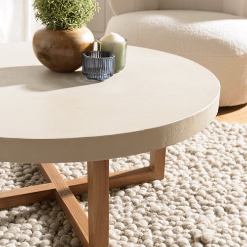 Table basse ronde béton beige pieds bois croisés DIKA