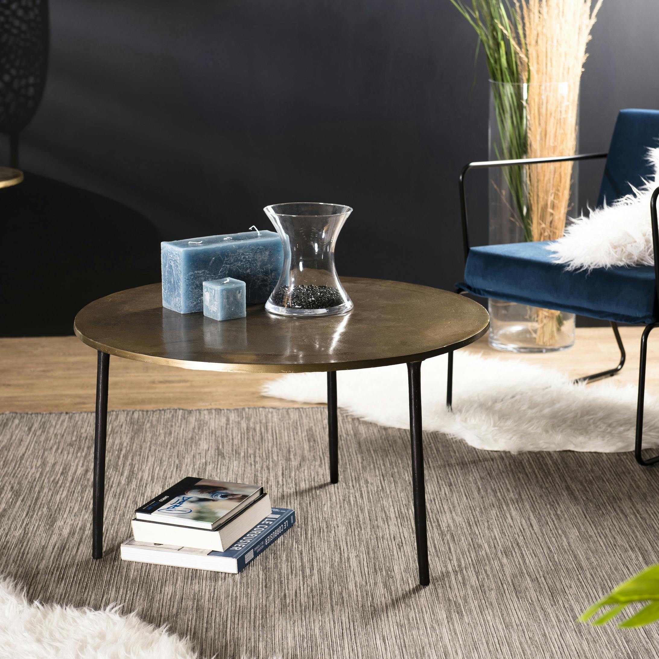 Table basse ronde en metal dore de style contemporain