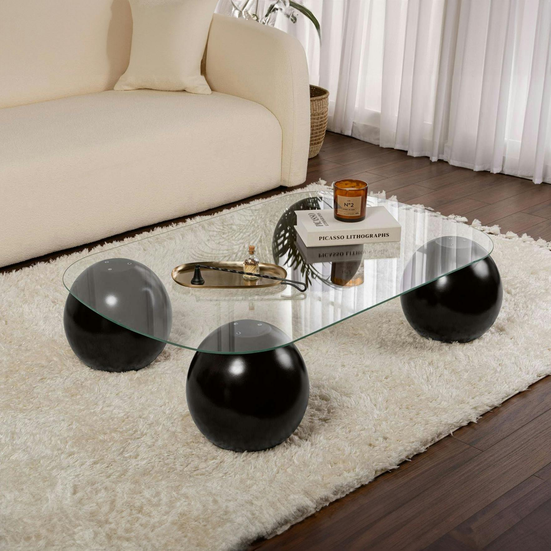 Table basse verre bords arrondis - 4 pieds boules noirs KOCHI