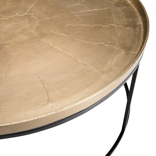 Table basse ronde en metal dore et noir de style contemporain