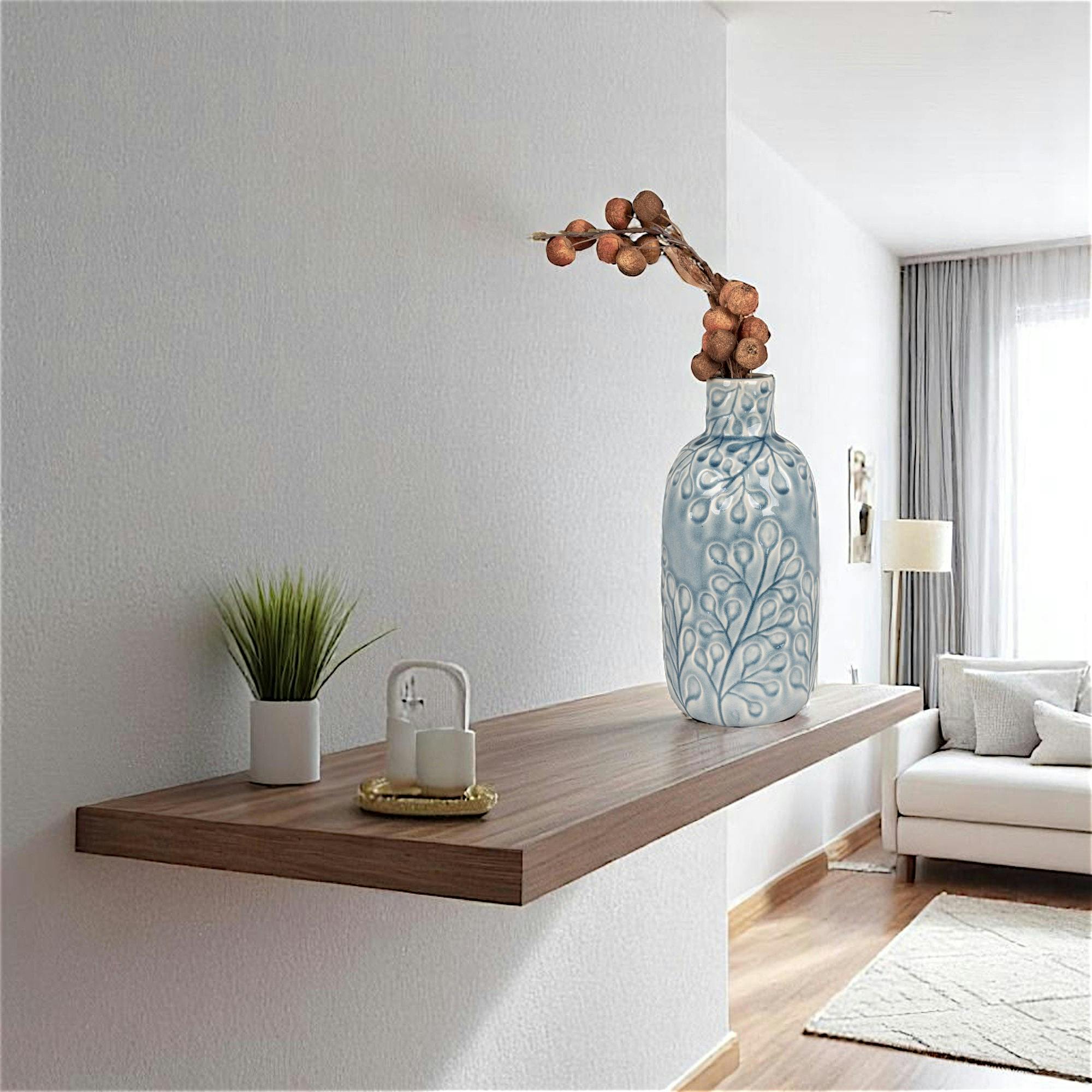 Vase décoratif bleu avec motif fleurs